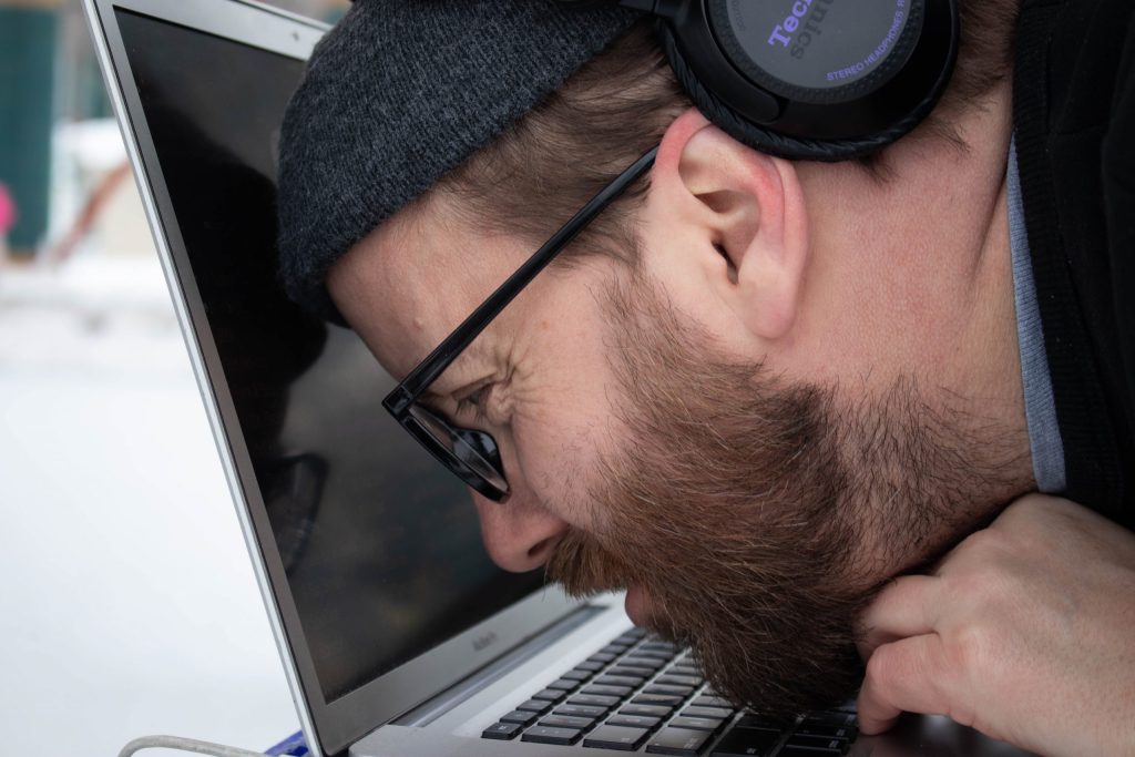 Tyler a centimetre away from his laptop to see it.