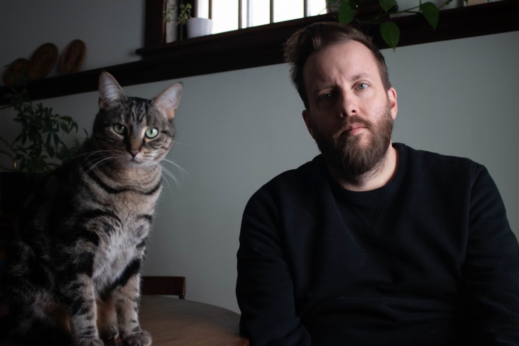 Tyler and his cat, Alfie.