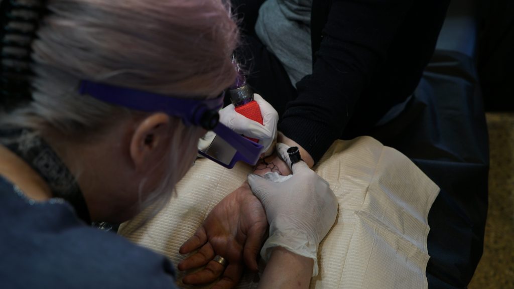 A close up of a heart with wings tattoo Hamilton is giving a client