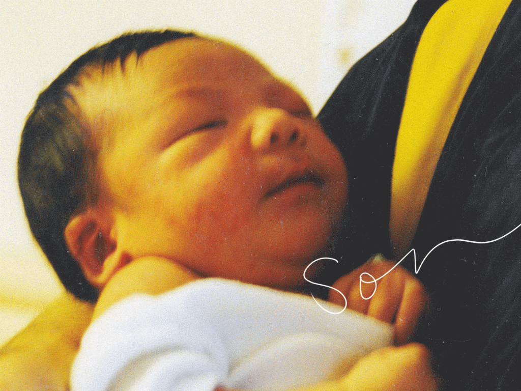 A dad holds his newborn son at Victoria Hospital in Winnipeg, Manitoba in the year 2000. A doodle animation outlines the baby and spells out "Son."
