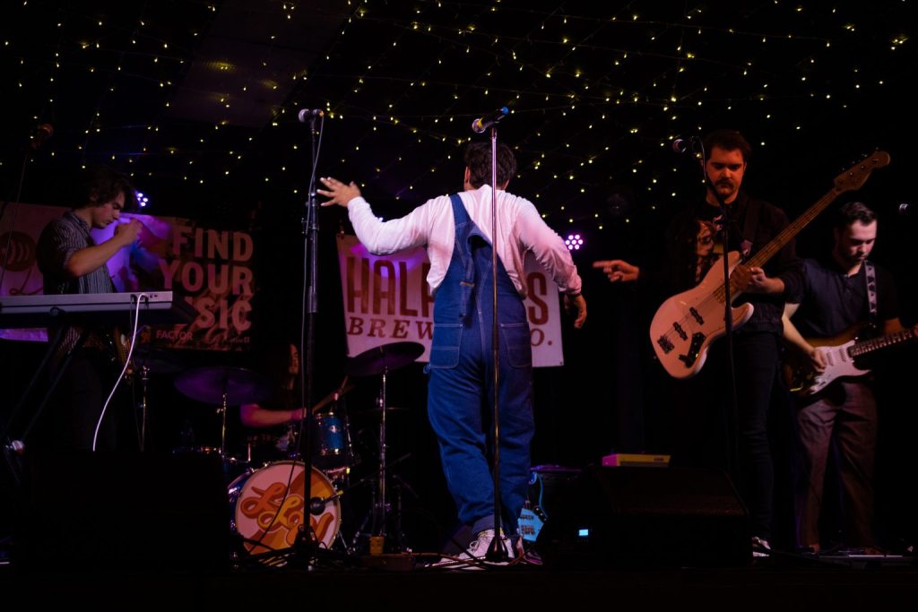 The Love Letter Writers rock out on The Good Will Stage. Nathaniel Muir dancing to the music.