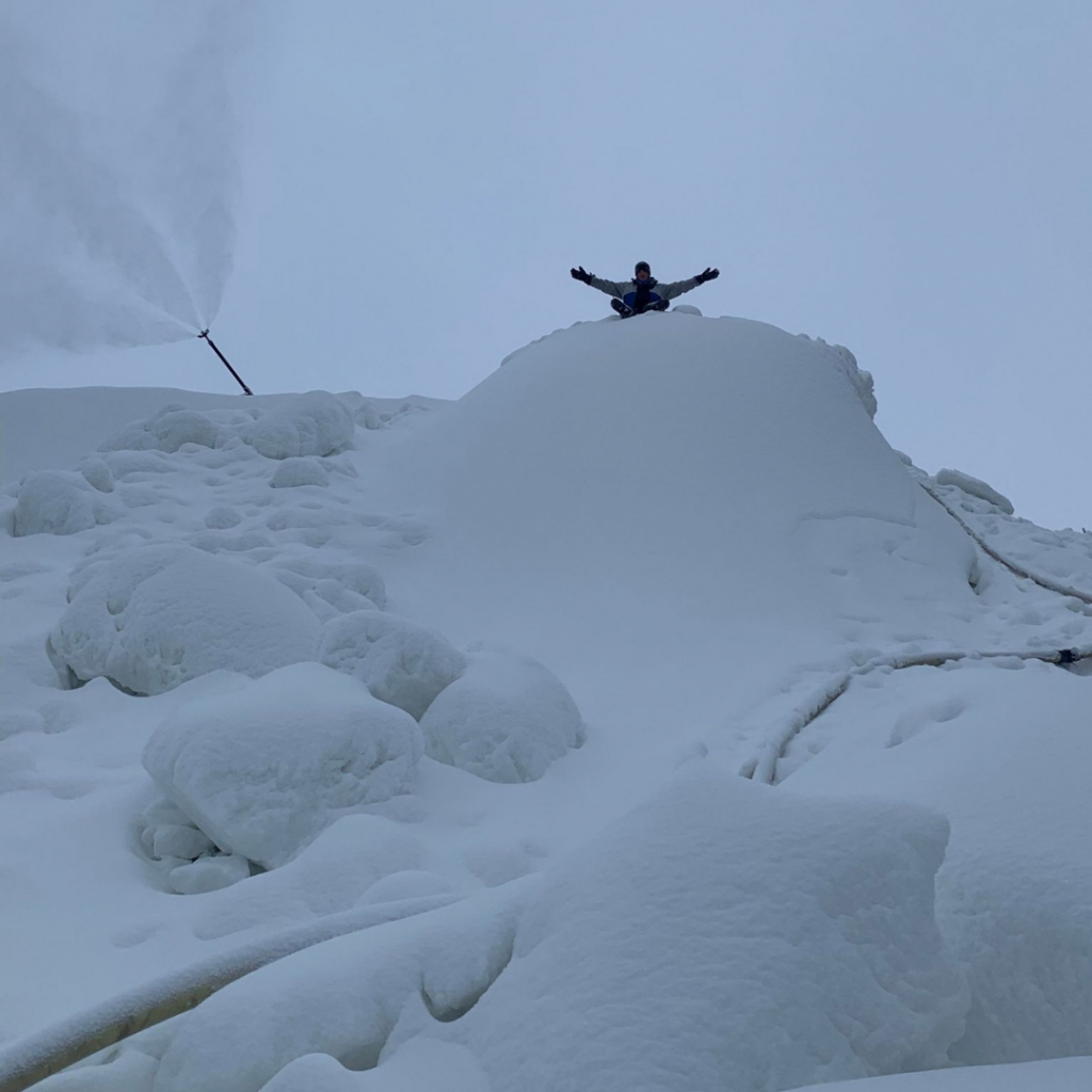 Snowmaker sits on pile of snow at Asessippi