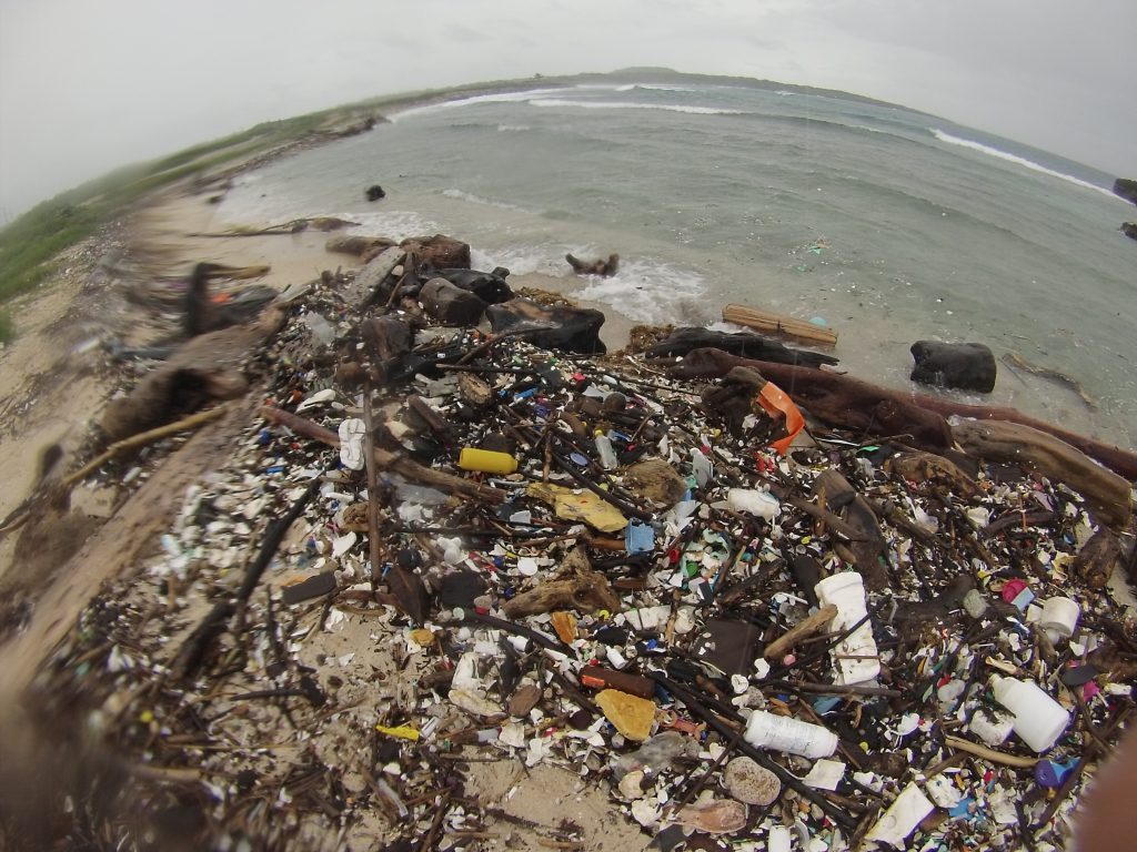 Garbage covering a beach.