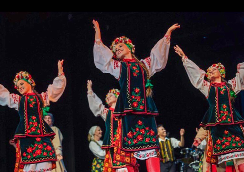 Janelle and other dancers dressed in their hopka costume performing.