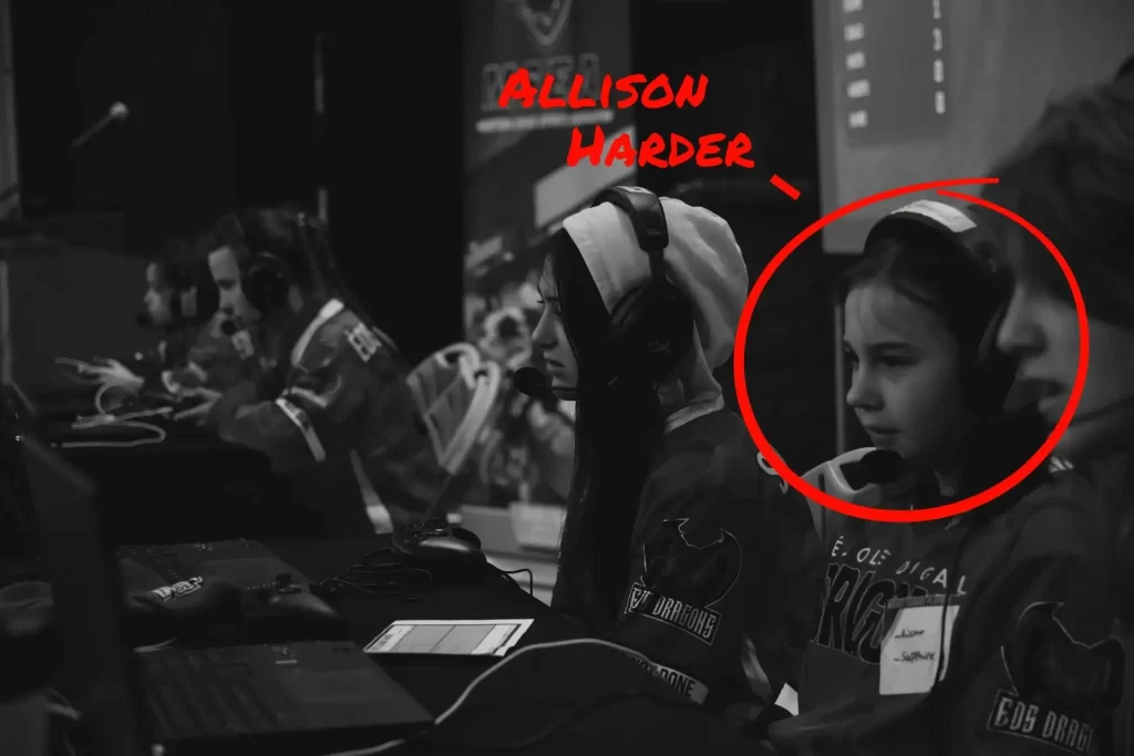 A student competitor focuses on her screen during a match.