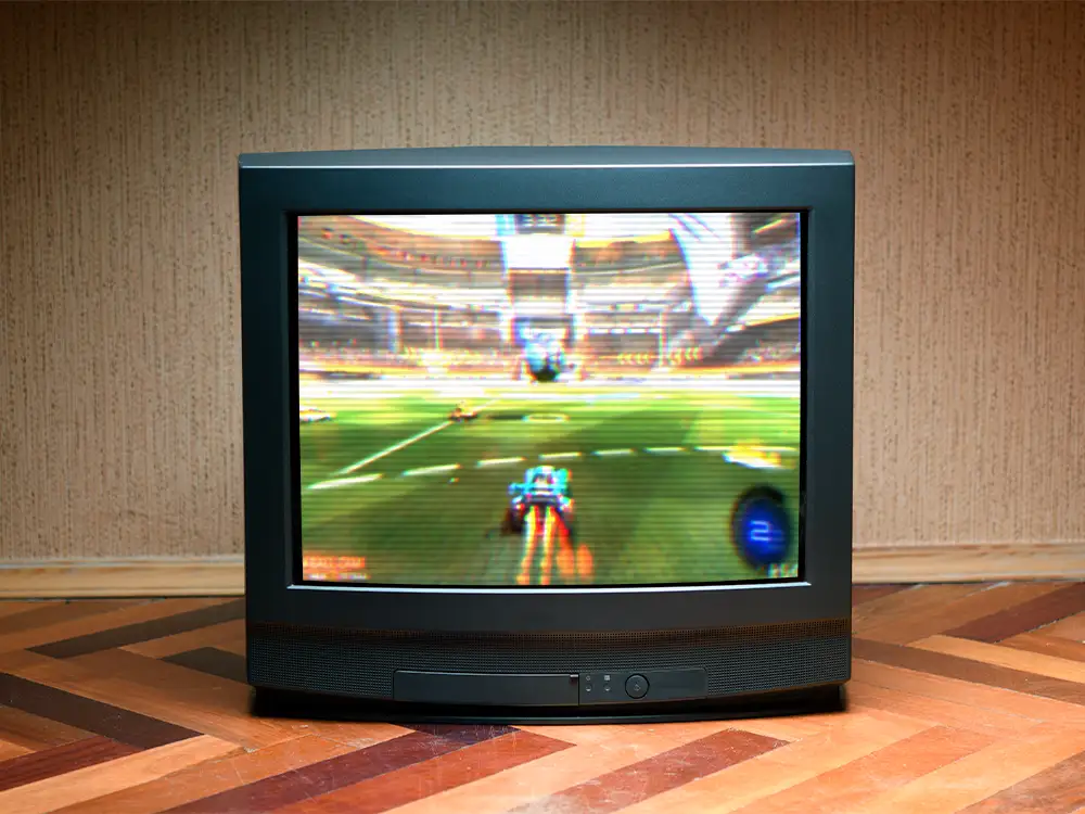 CRT TV with video game Rocket League on it