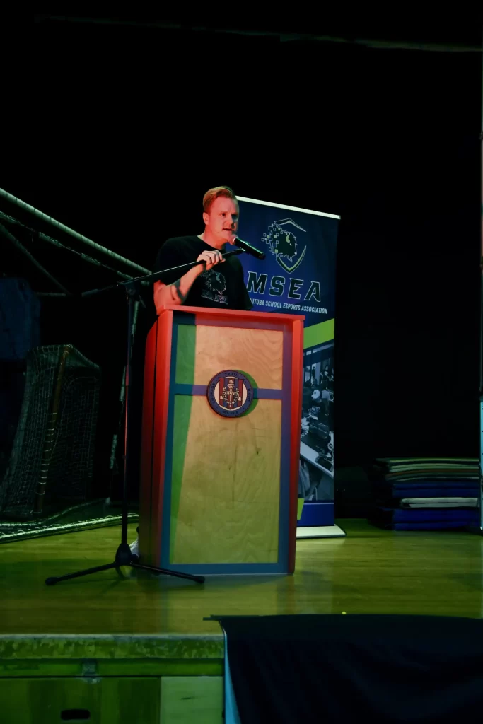 A speaker addresses the crowd from a podium at the event.