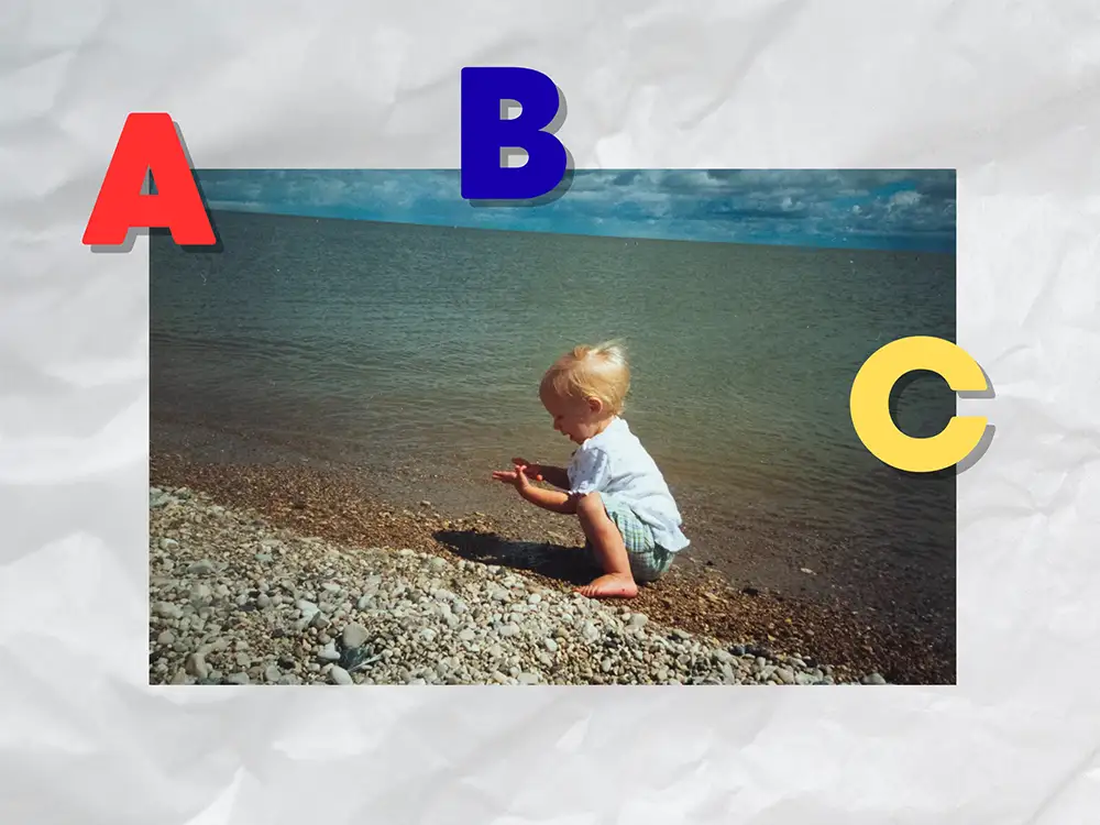 Scrapbook style page, picture from childhood on the beach in Gimli. ABC magnets holding up the picture. 