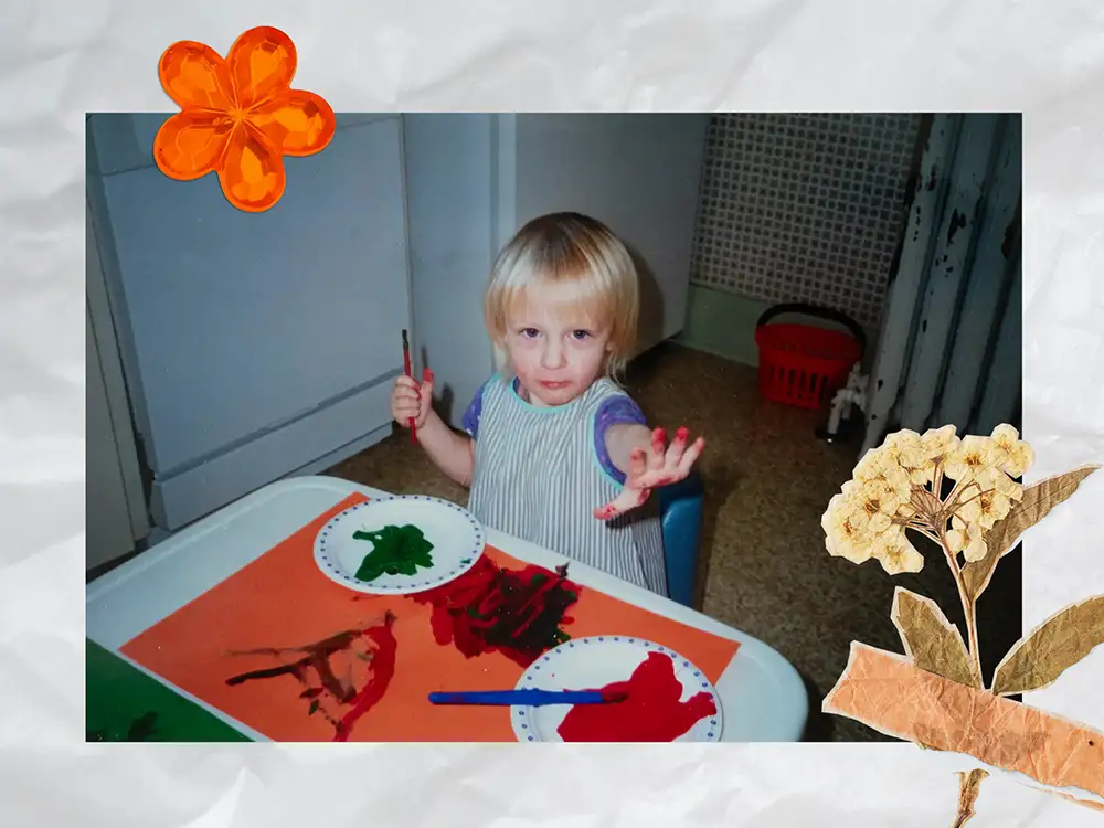 Scrapbook style page, childhood picture of finger painting in the kitchen. 