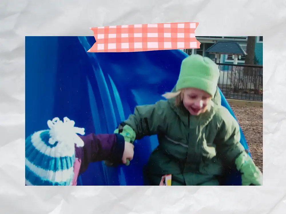Scrapbook style page, picture of my friend and I going down the slide holding hands. 