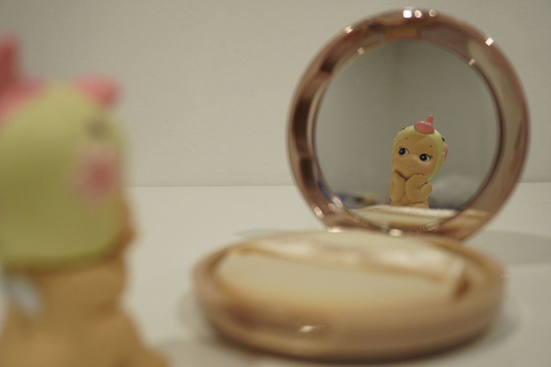 2026-ChelseyHernando-my Sonny Angel looking at a compact mirror