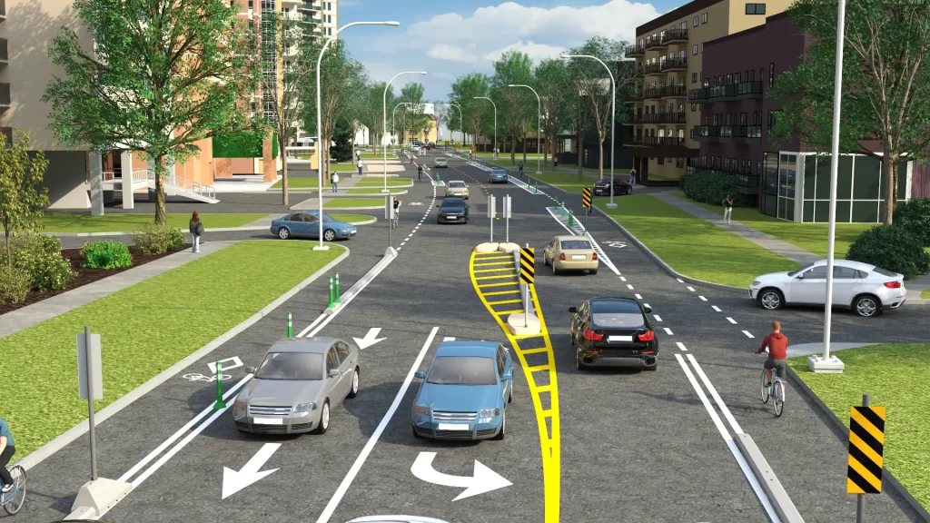 A photo realistic 3D rendering shows two lanes of opposing traffic on Wellington Avenue with a left turn lane at Gertrude Avenue. Bike lanes run parallel to traffic on both sides with solid white line and temporary pilons separating them form vehicular traffic.