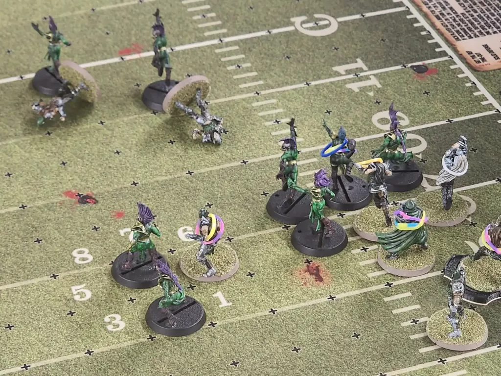 Blood Bowl being played on a game board