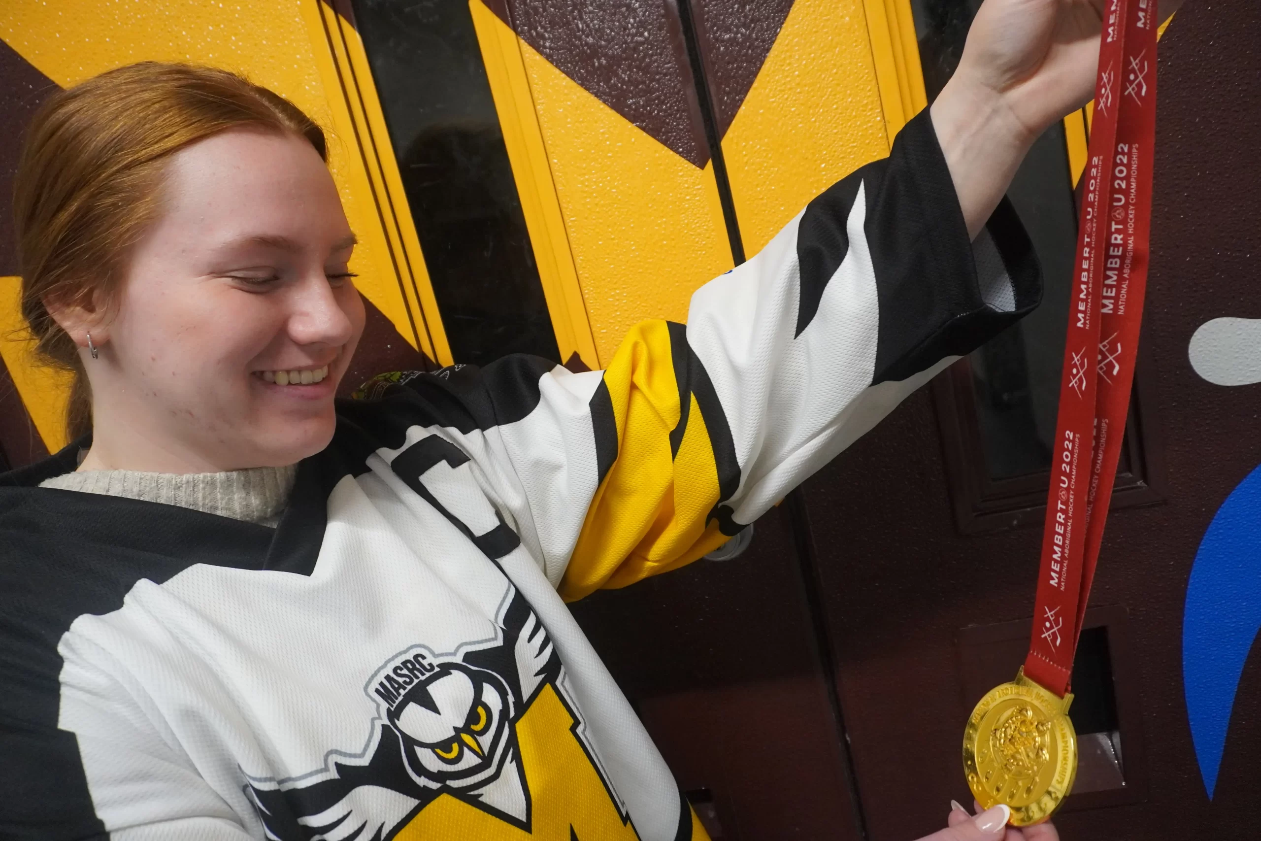 Dana Goertzen looks at her 2022 NAHC gold medal